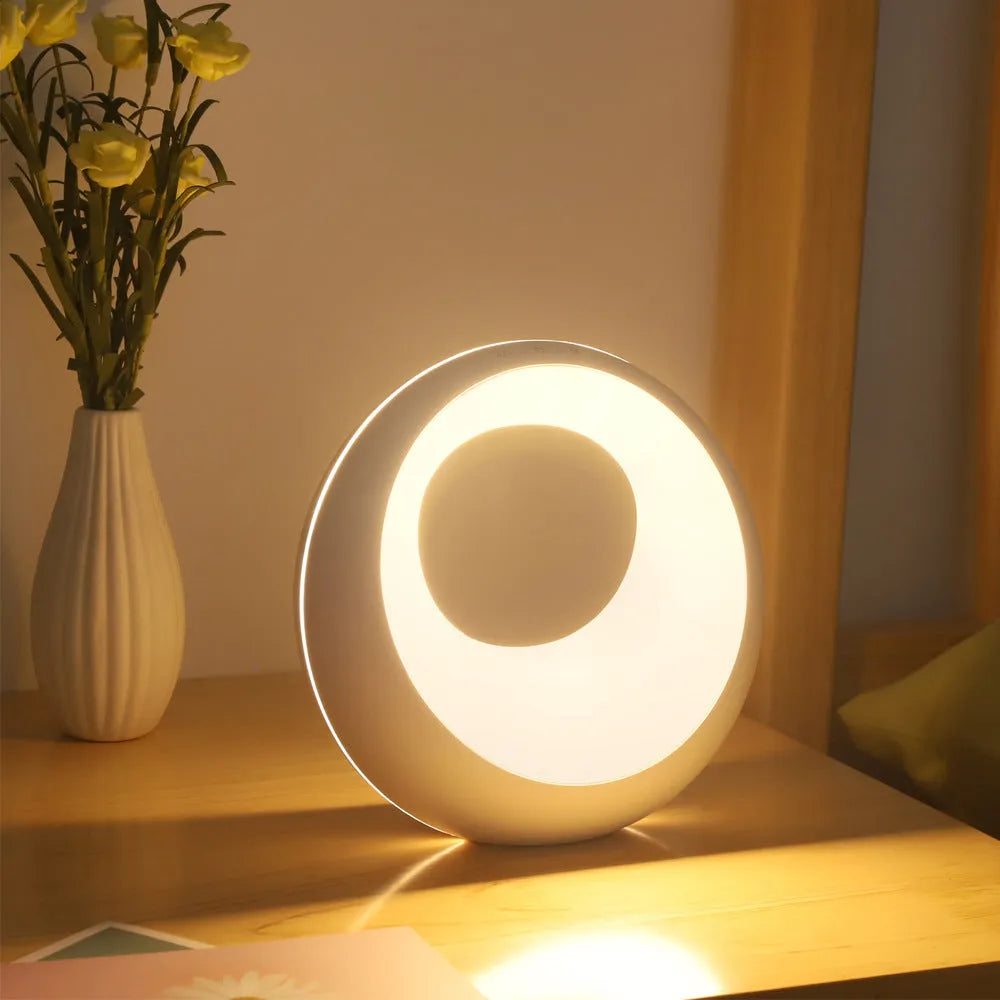 Creative Touch small RGB colour changing desk lamp with remote control on wooden surface