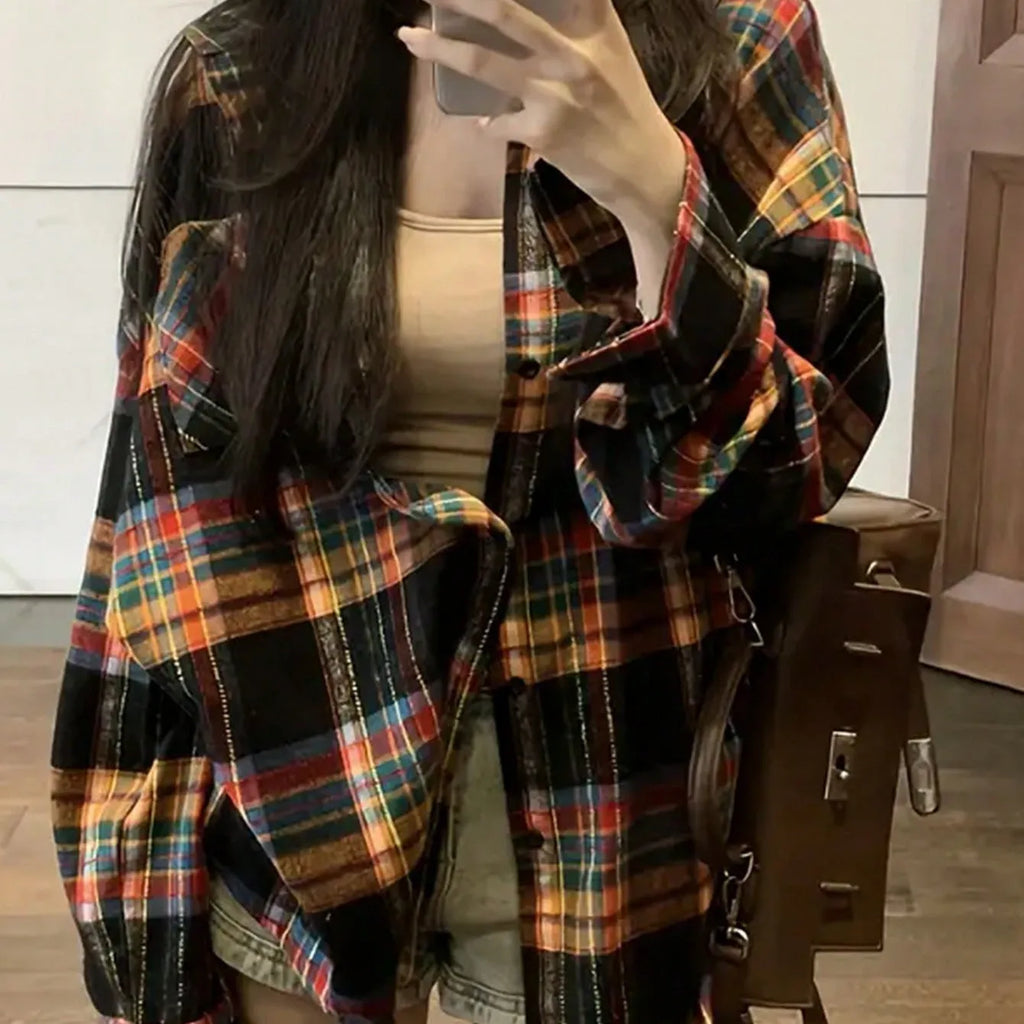 Women's loose fit cotton plaid shirt in black, shown with long sleeves and a button front.