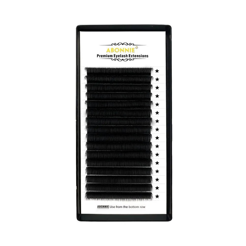 Dense 16-row mink hair false eyelashes on a white background, showing natural fibre texture.