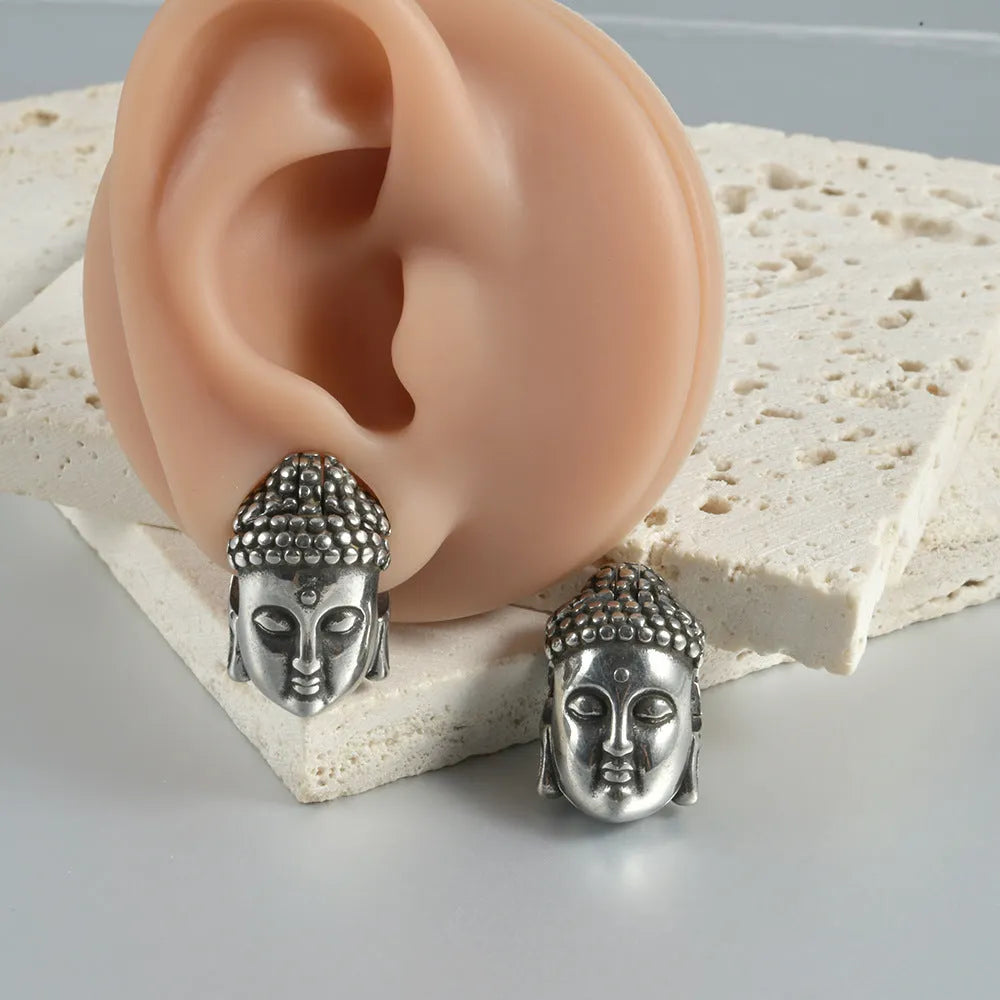 Hollow skull Buddha stainless steel earrings with geometric hip hop styling in auricle piercing design
