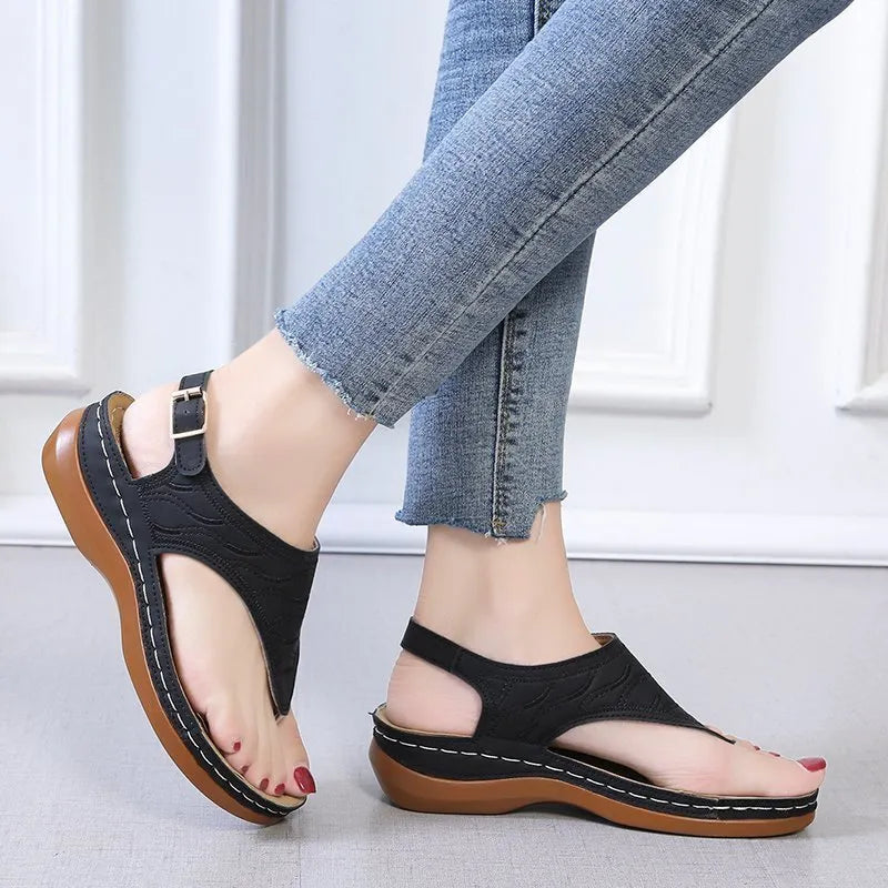 Women's casual wedge-heel sandals with adjustable buckle strap in a solid colour.