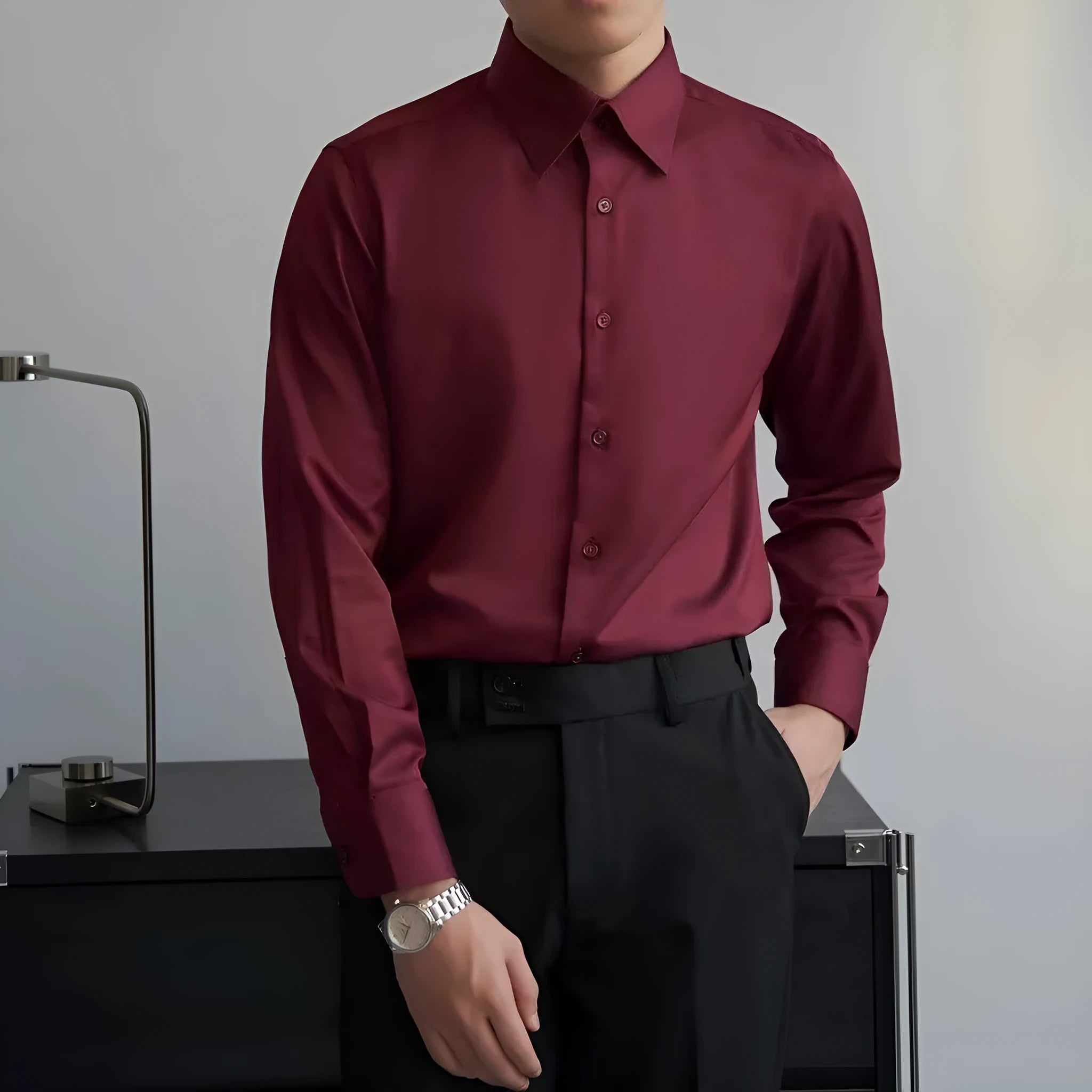 Man wearing a black slim-fit Japanese retro style long sleeve cardigan shirt.