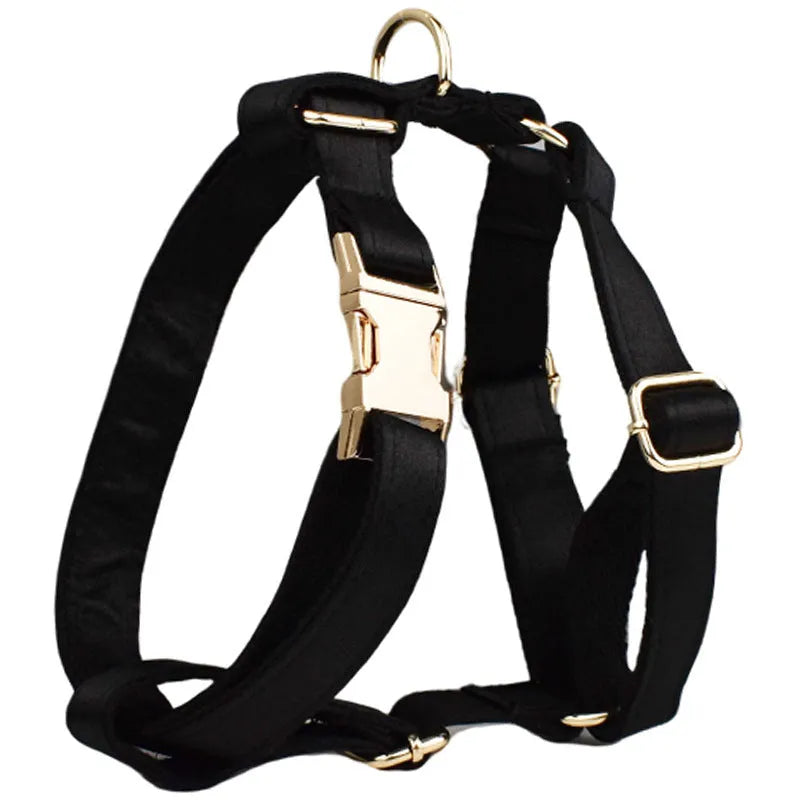 Dog wearing cloth chest strap harness with matching collar, leash, and decorative bow tie