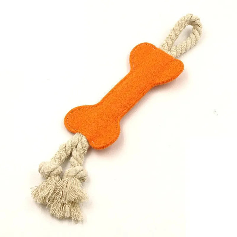 Bone-shaped felt dog chew toy with rope knot interior in blue, shown next to a tape measure indicating 16 cm length.