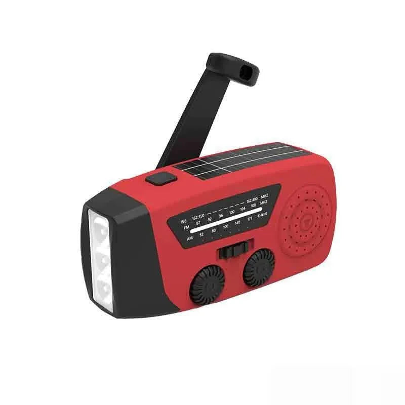 Red rechargeable emergency radio torch with hand crank, LED light, and USB charging port