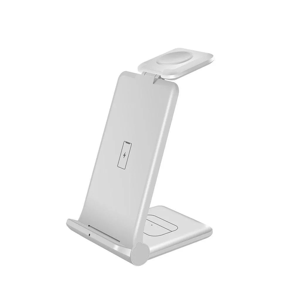White 3-in-1 foldable wireless charging station charging an iPhone, Apple Watch, and AirPods case on a desk.