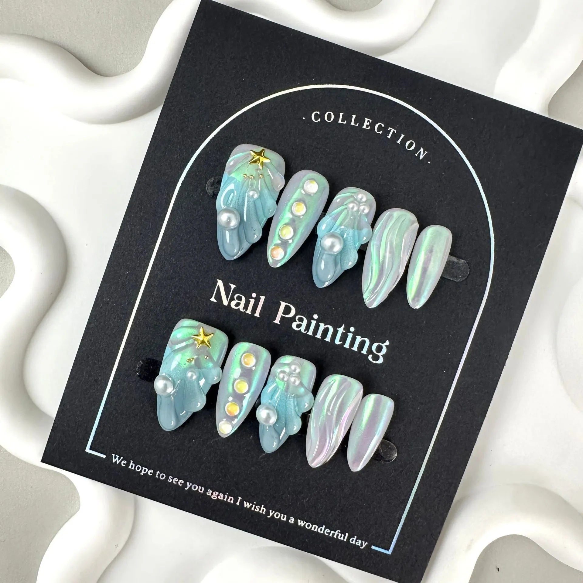Blue plastic false nail shells for women in XS, S, M, and L sizes.