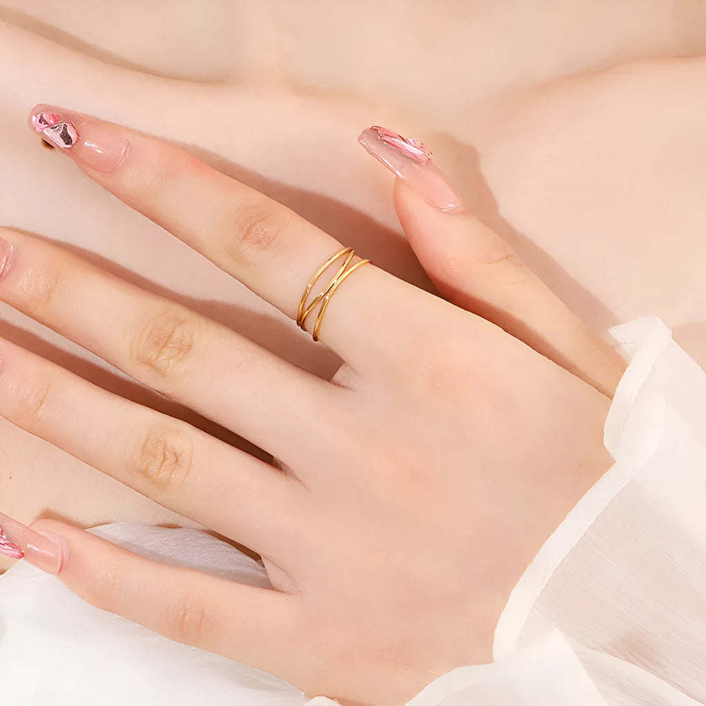 Geometric three-layer coil ring with gold electroplated finish on titanium steel