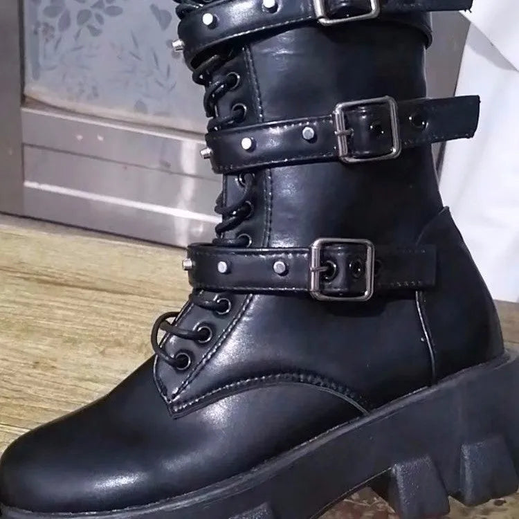 Black women's mid-calf knight boots with metal buckle and side zipper on a round toe.