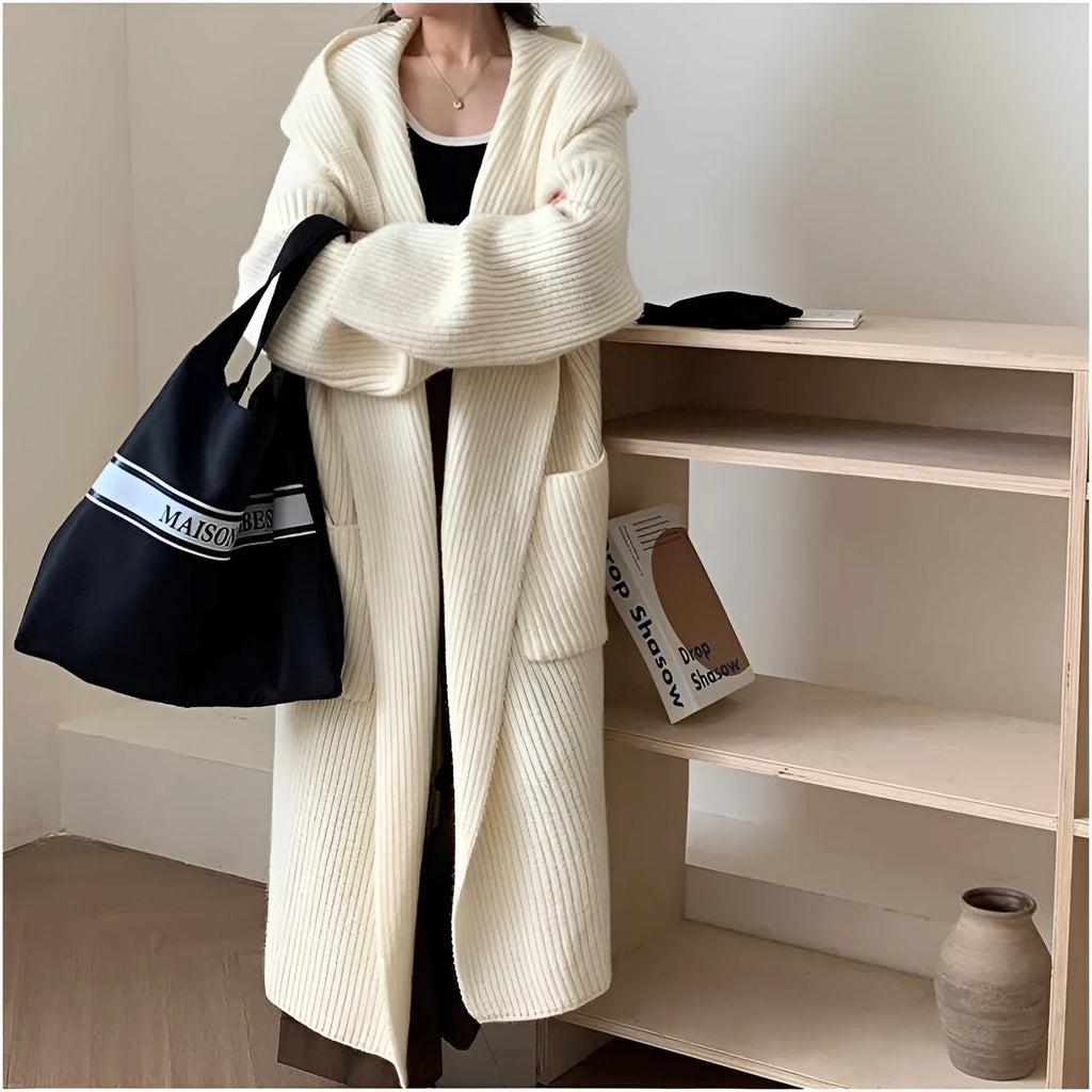 Women's loose grey hooded cardigan coat with raglan sleeves on hanger