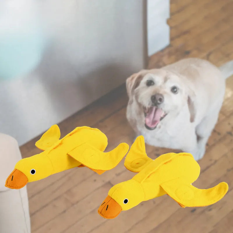 Yellow plush duck dog toy with a treat compartment and built-in sound module for training and enrichment.
