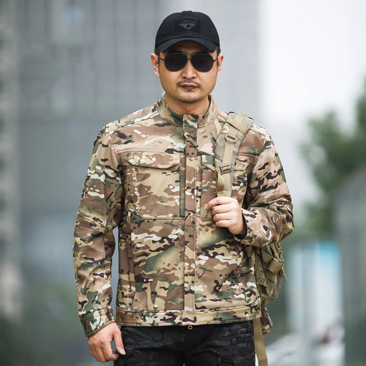 Bone Frog Peak Breaker black soft shell tactical jacket shown on model for mountaineering.