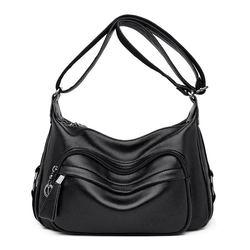 Large blue women's shoulder bag with multiple internal compartments and crossbody strap