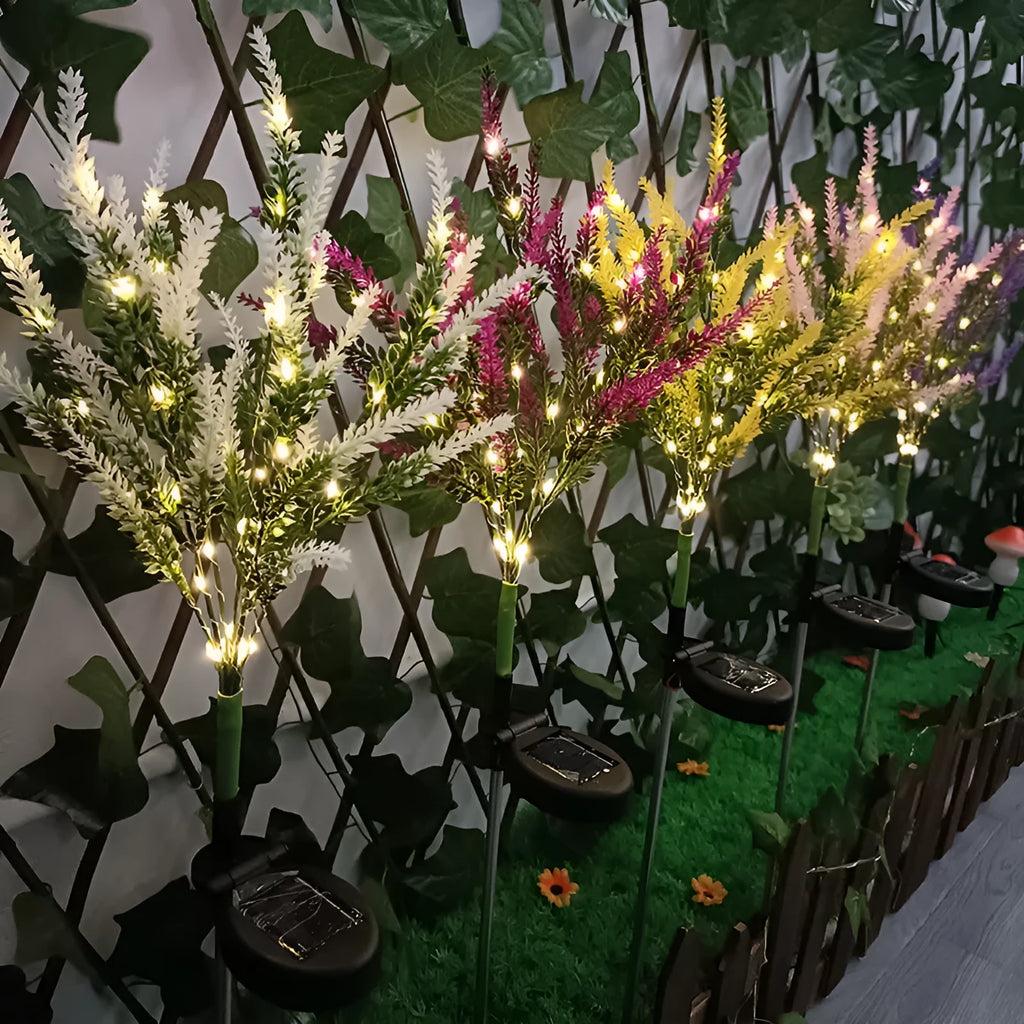 74cm tall solar-powered LED garden light with artificial flower design in lavender colour variations
