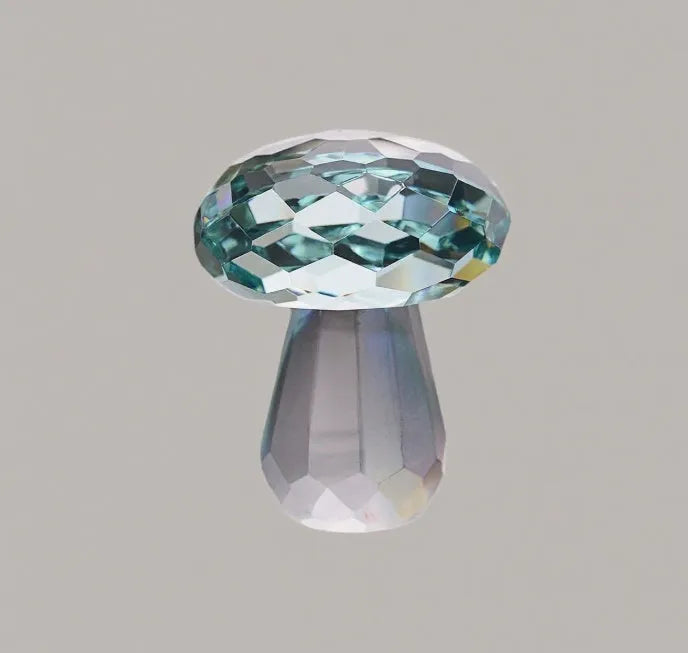 Colourful crystal mushroom decoration in modern geometric style on a white background.