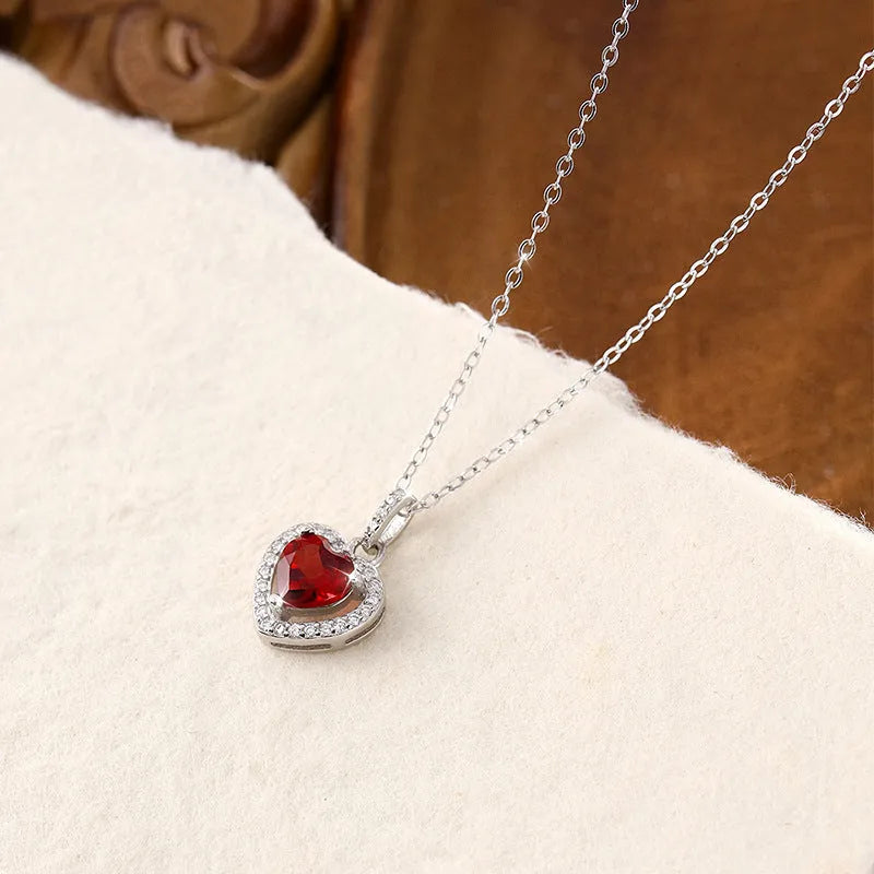 Women's sterling silver necklace with heart-shaped natural gemstone pendant on cross chain