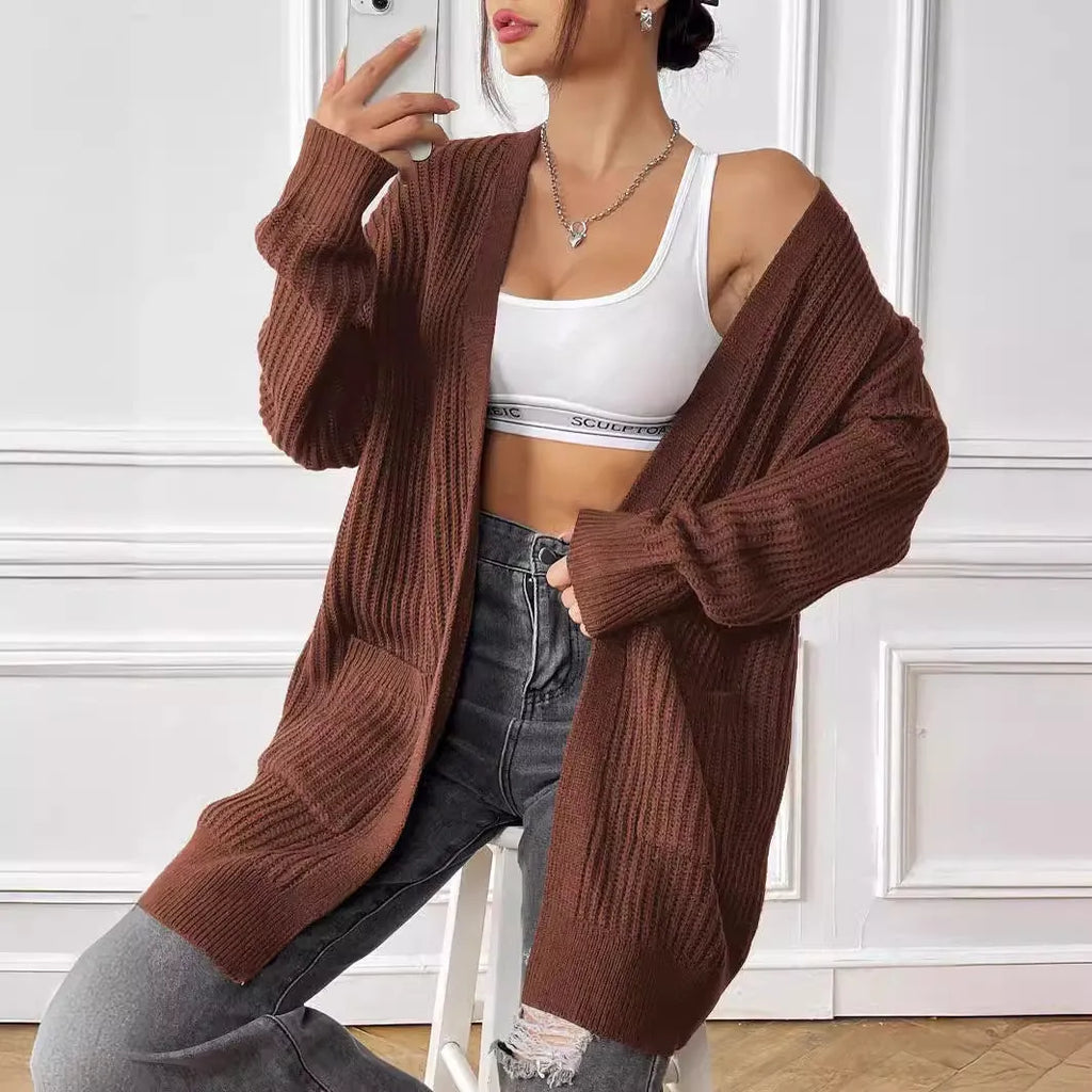 Women's loose fit acrylic cardigan sweater with double pockets in dark green colour