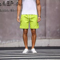 Men's loose-fit workwear shorts in cool silk cotton fabric available in fluorescent green and army green colours