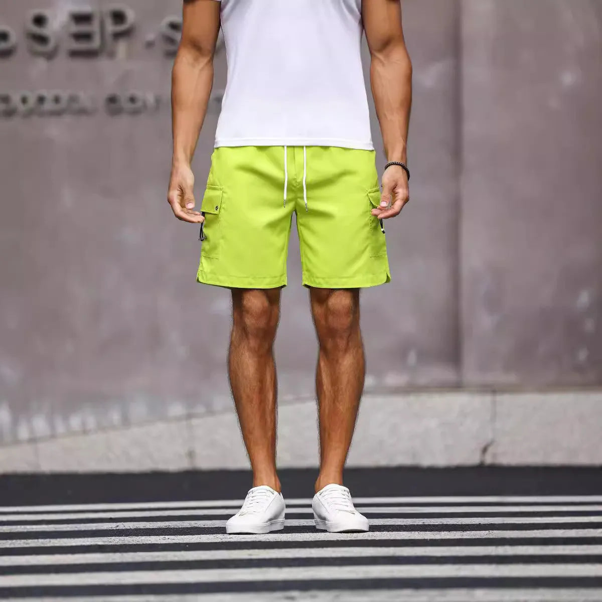 Men's loose-fit workwear shorts in cool silk cotton fabric available in fluorescent green and army green colours