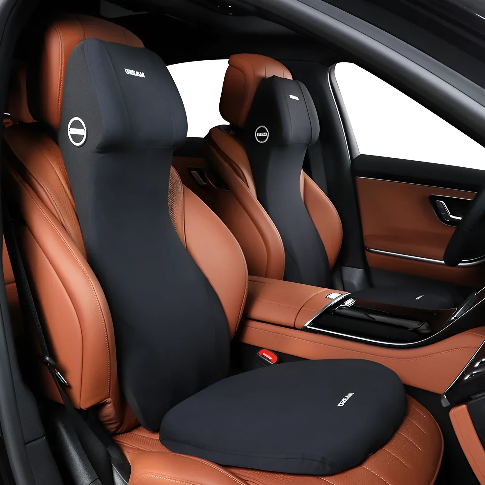 Black automotive memory foam cushion and headrest lumbar support pillow set on a car seat.