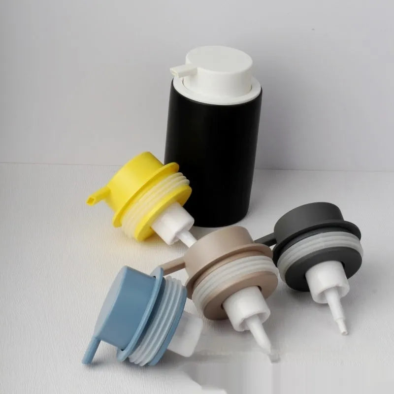 ABS plastic foam pump for facial cleanser in metallic gold finish with large foaming dispenser head.