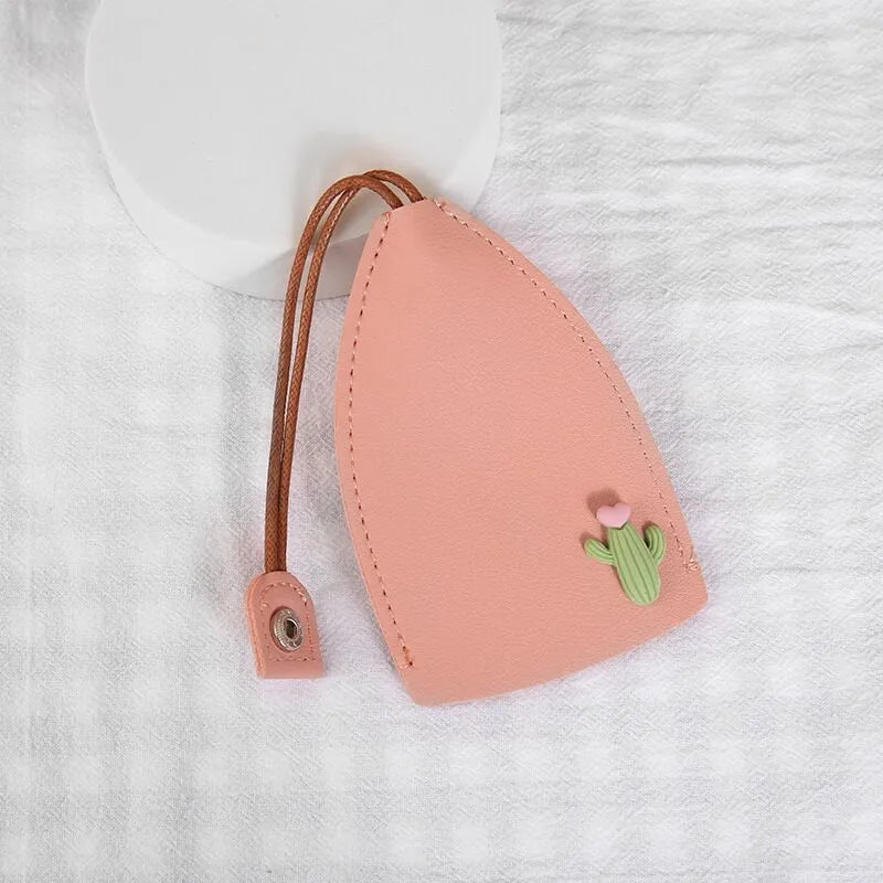 Colourful cartoon pull-out key case made from PU leather, showing the key extended from its protective sleeve.