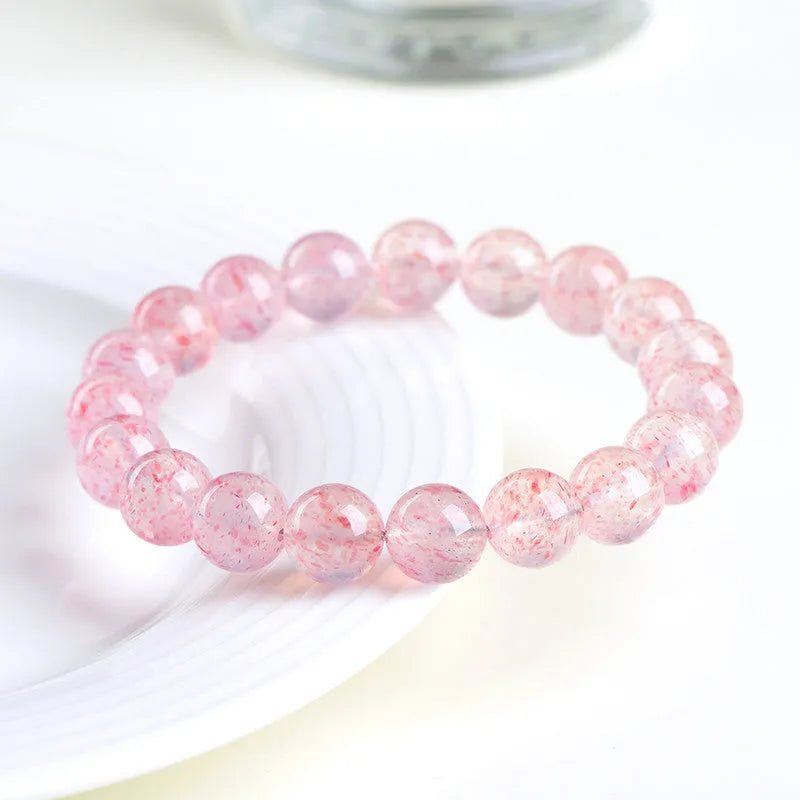 Natural white water strawberry quartz crystal ball bracelet with 19 polished 10-10.8mm beads.