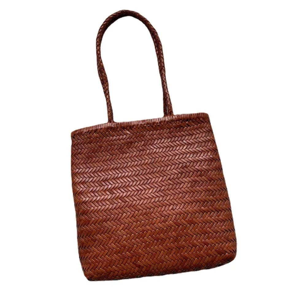 Handmade brown woven tote bag made from vintage top layer cowhide leather with a three-dimensional pocket.