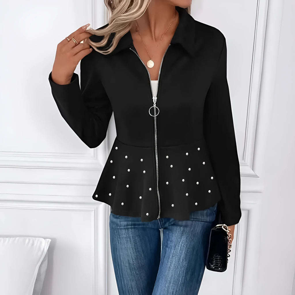 Women's black loose-fit coat with beaded heavy-duty zip and ruffle hem detail.