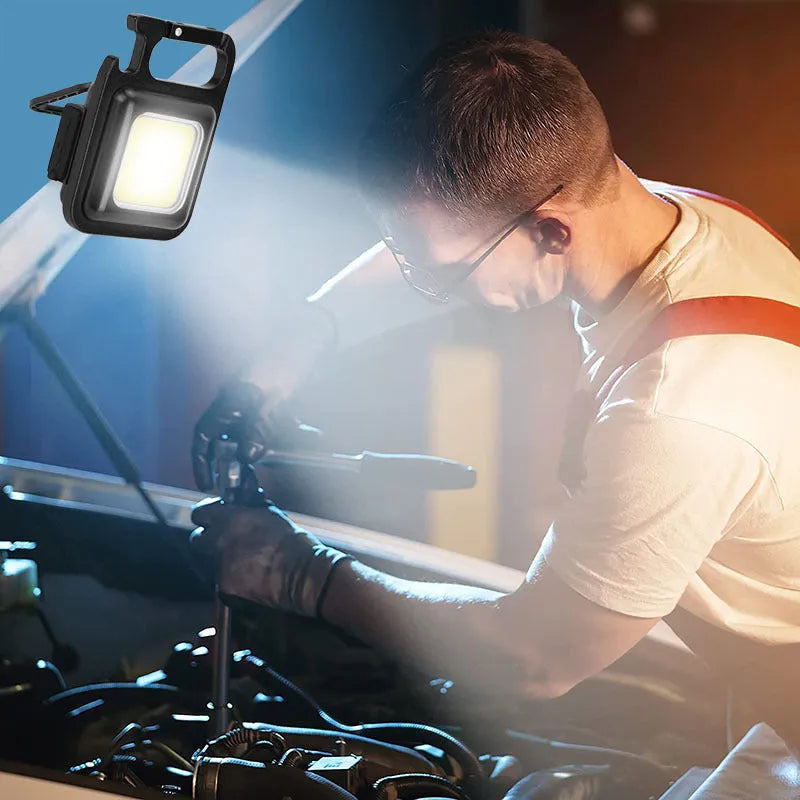 Black aluminium alloy USB keychain light with magnetic base and foldable handle