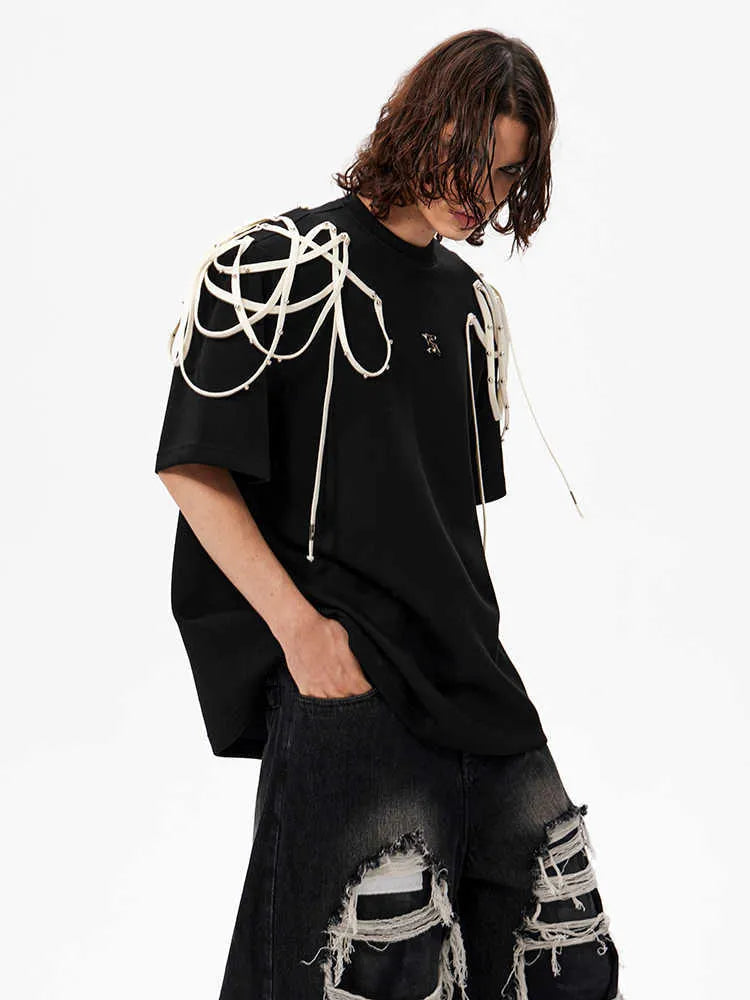 Black women's t-shirt with decorative ribbon trim padded shoulders and rivet detailing