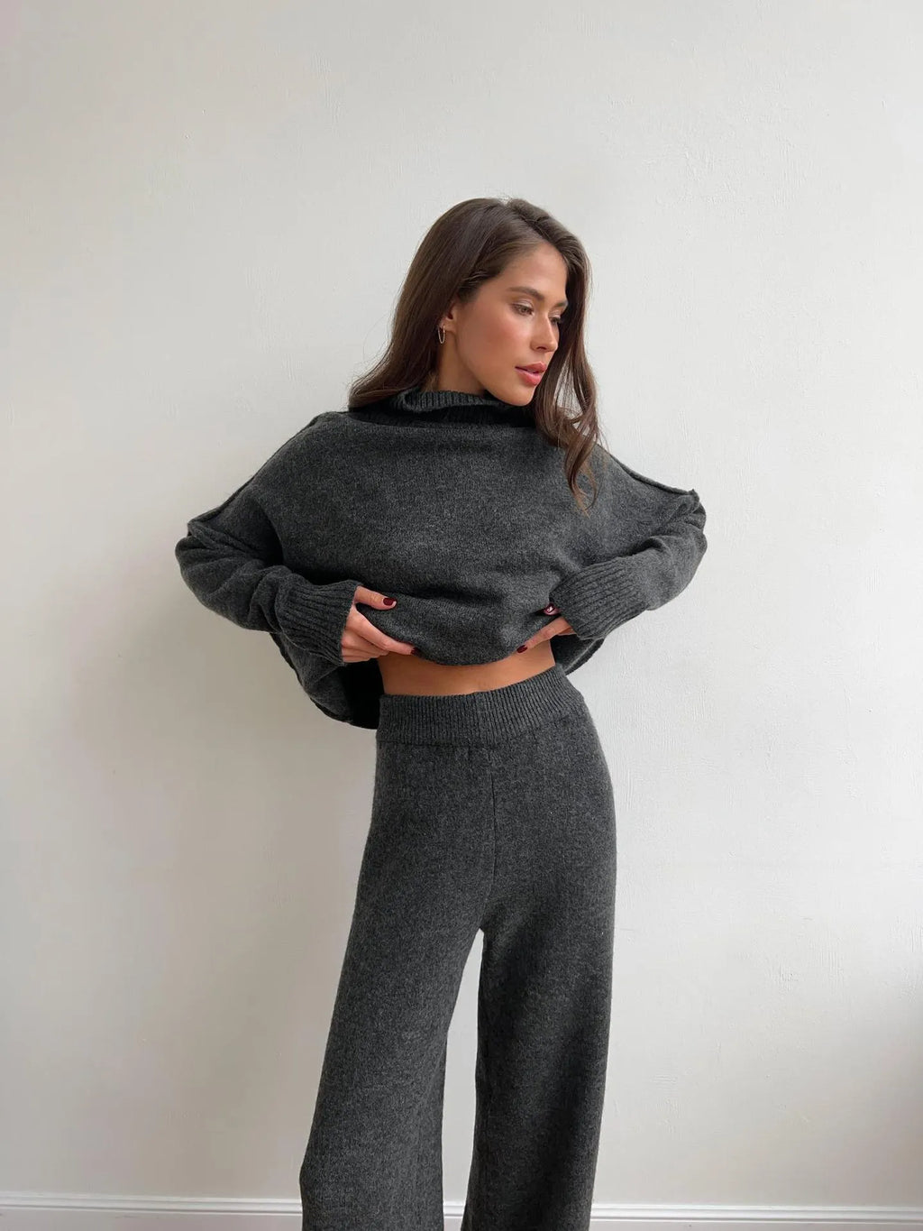 Women's acrylic two-piece suit with side-slit sweater top and matching trousers in dark grey