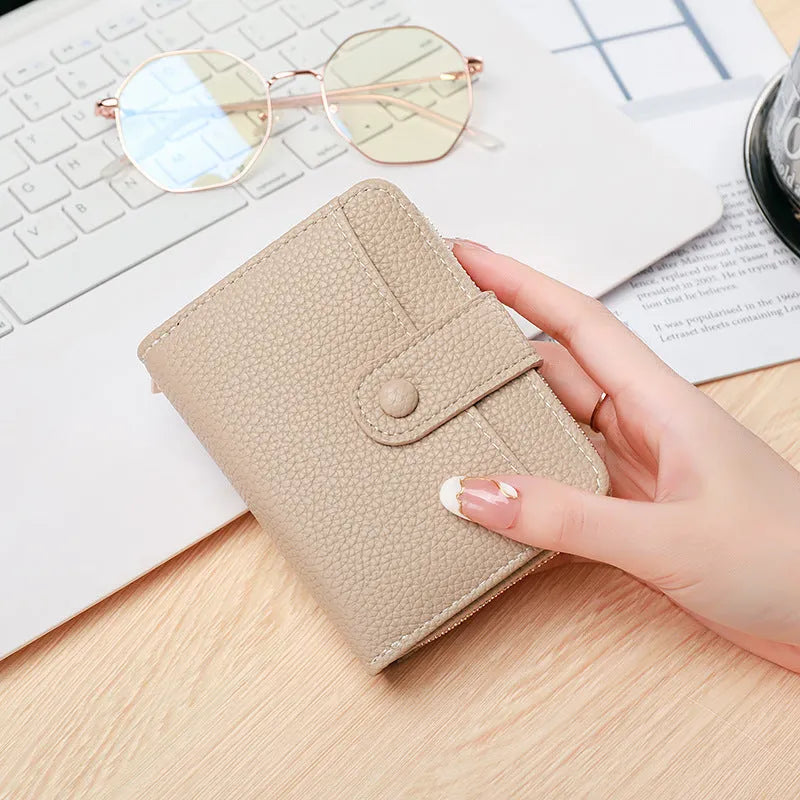 Ladies short wallet with lychee pattern in PU leather showing 2-fold design