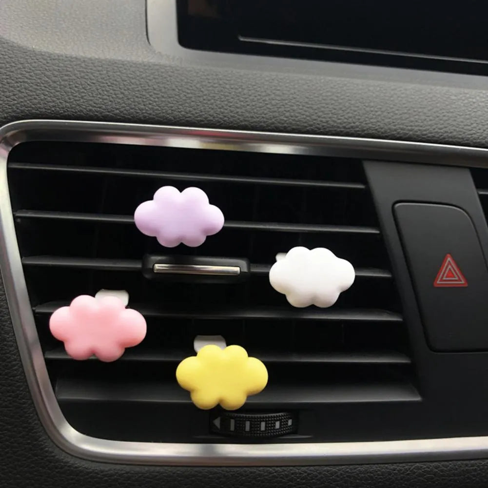 Resin cartoon car fragrance clip in light green colour mounted on car air vent