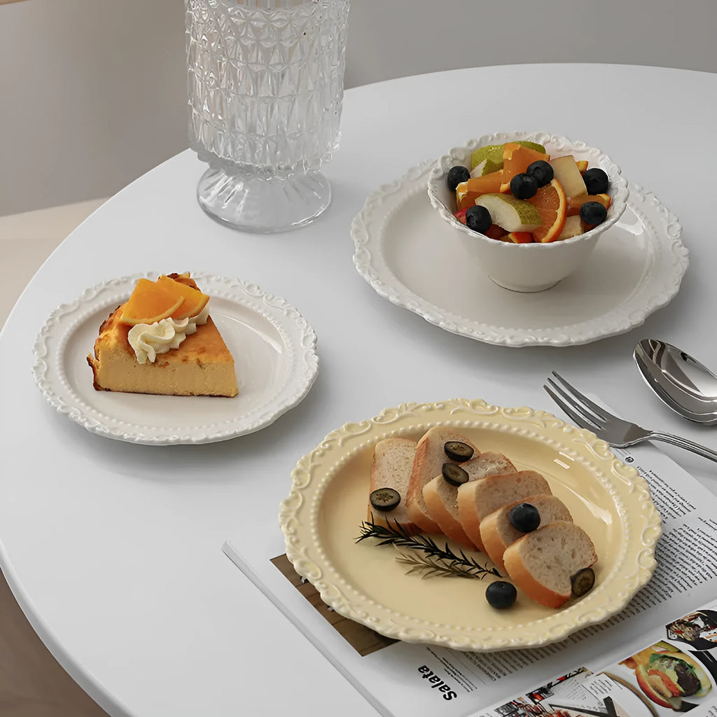 Vintage lace ceramic plate with irregular shape and coloured glaze in white or yellow