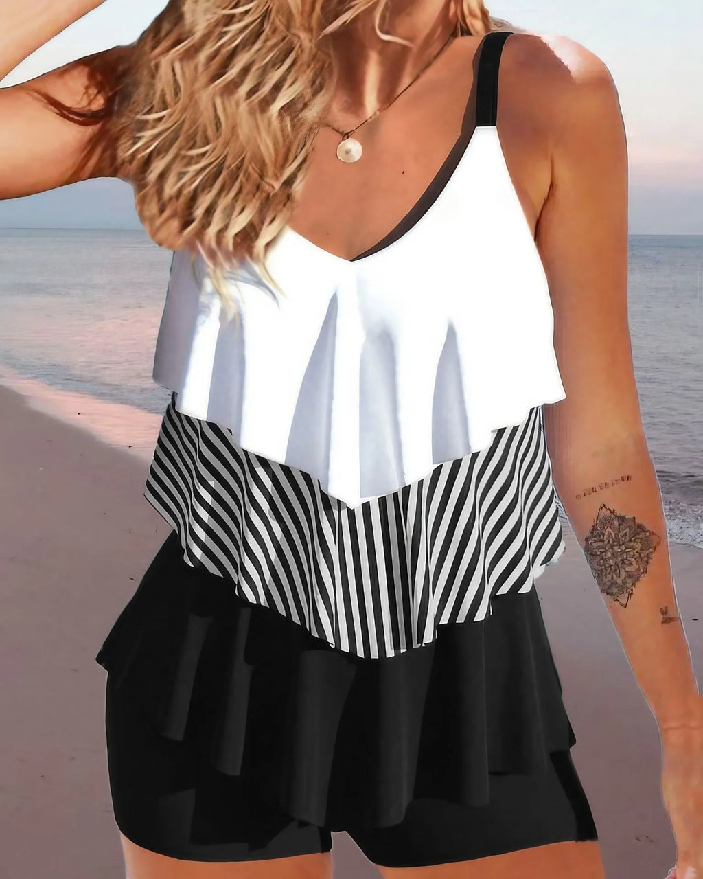 Women's two-piece bikini swimsuit with sleeveless backless design and spaghetti straps