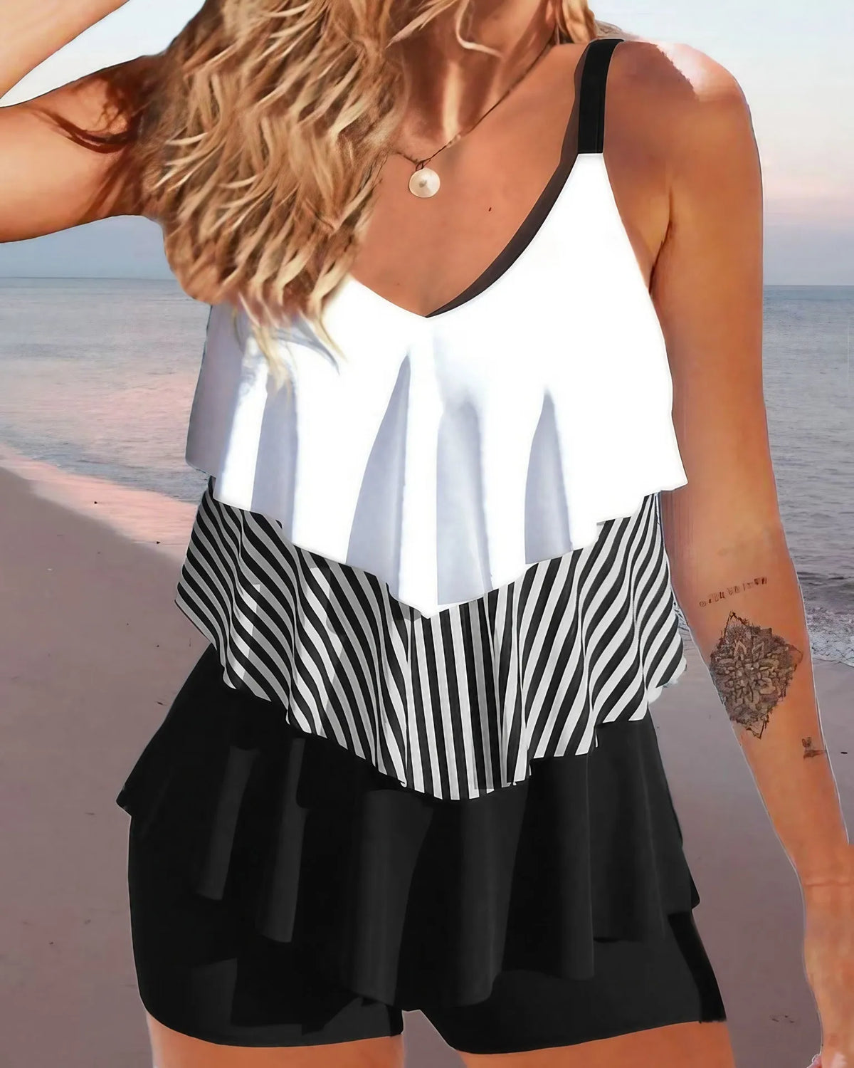 Women's two-piece bikini swimsuit with sleeveless backless design and spaghetti straps