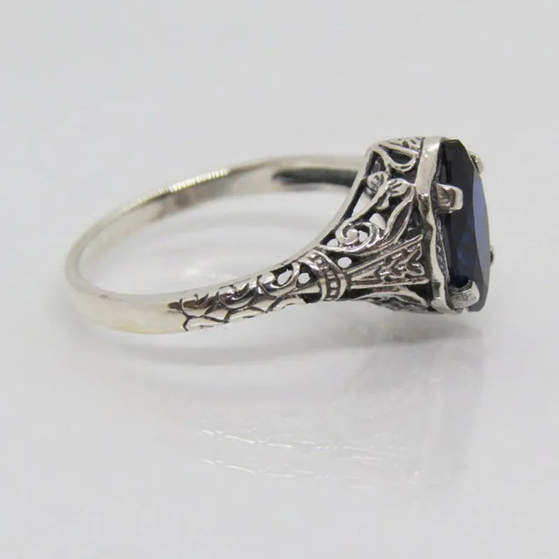 Silver women's geometric hollow ring with zircon accents on alloy band