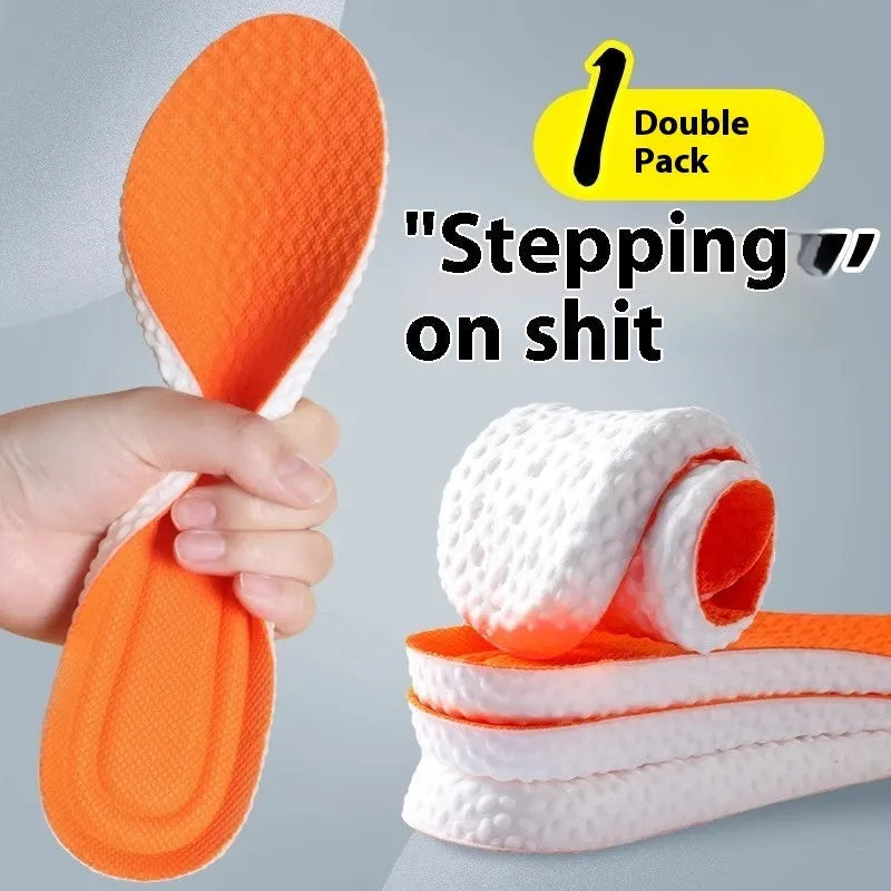 A pair of breathable, soft grey PU sports shoe insoles on a white background, showing their textured surface.