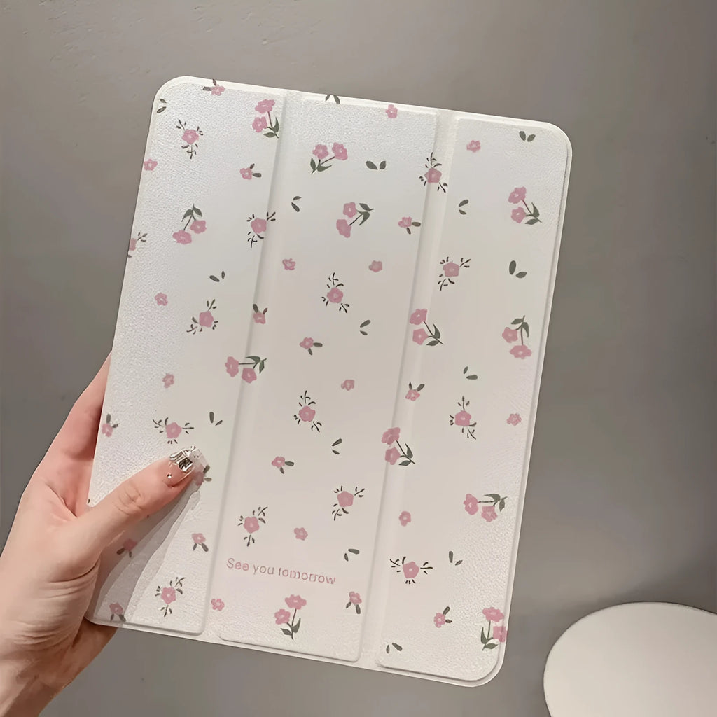 Transparent floral tri-fold tablet case for iPad showing magnetic closure and decorative pattern