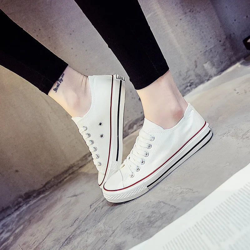 Women's solid colour canvas casual shoes shown in black, white black, white red, and all black colour options.