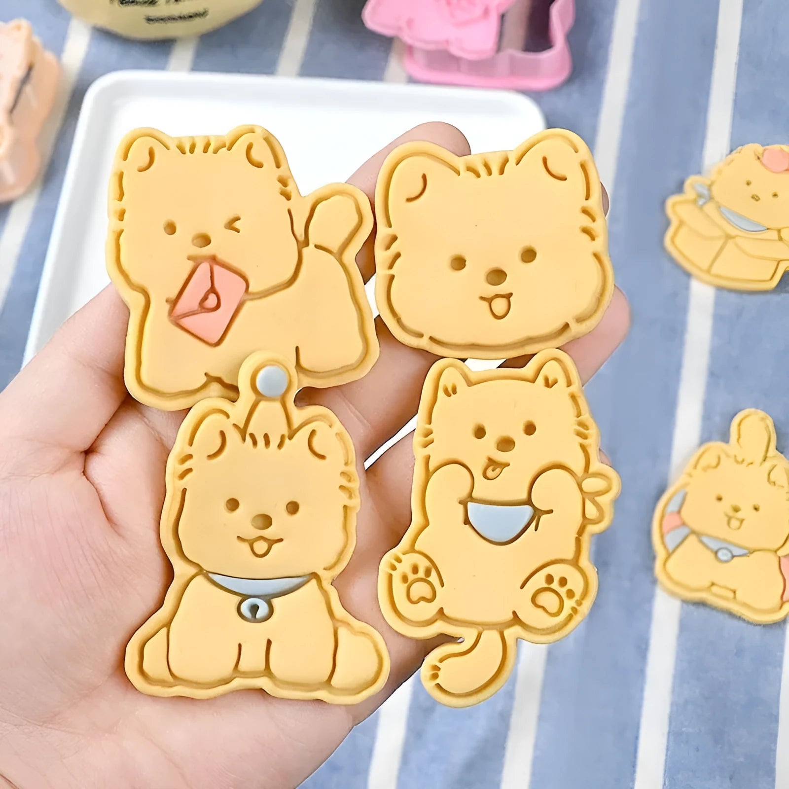 Three-dimensional plastic biscuit mould with puppy cartoon designs for making decorated dog-themed cookies and candies