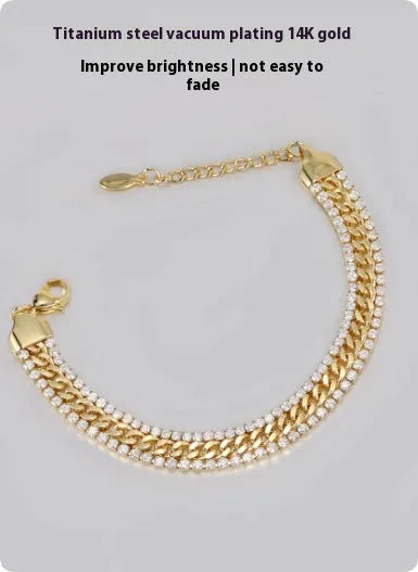 Gold tennis bracelet with gemstone inlay on titanium steel band.