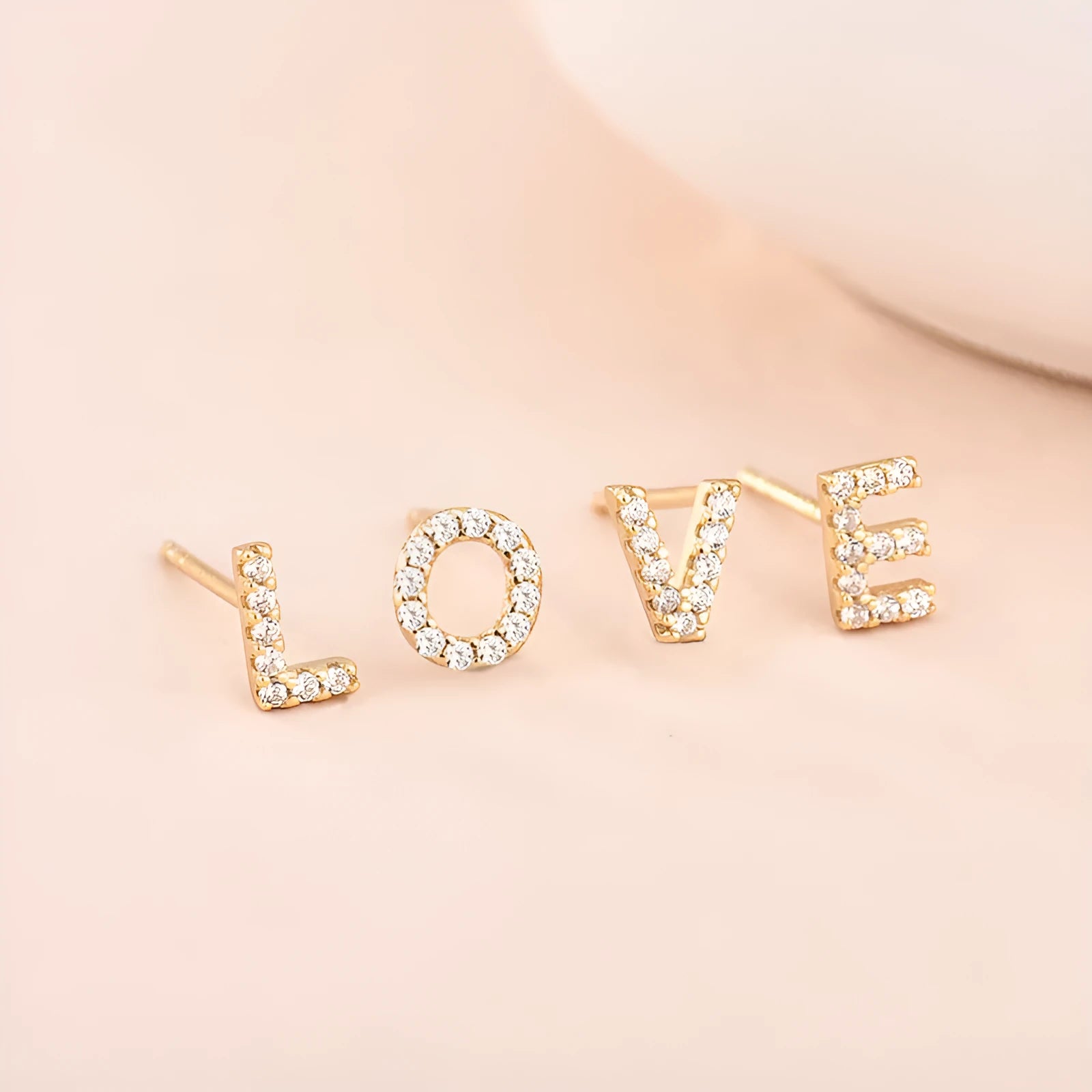 Brass gold-plated alphabet earrings showing single capital letter designs from A to Z with zircon elements
