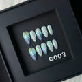 Blue plastic false nail shells for women in XS, S, M, and L sizes.