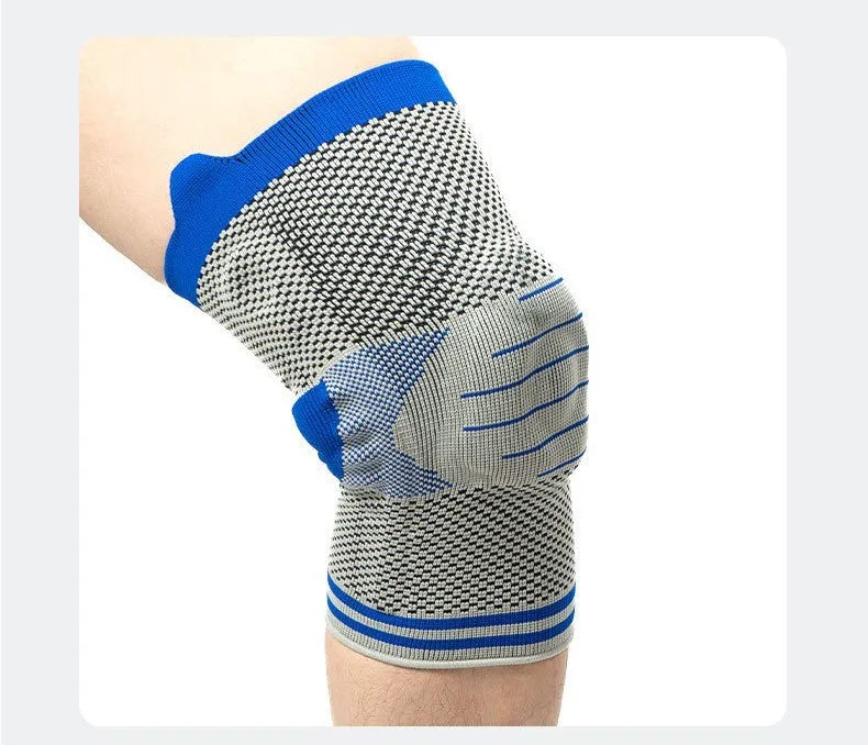 A cotton knee pad with a visible silicone massage spring bar shock absorber, shown in a grey and blue colour combination.