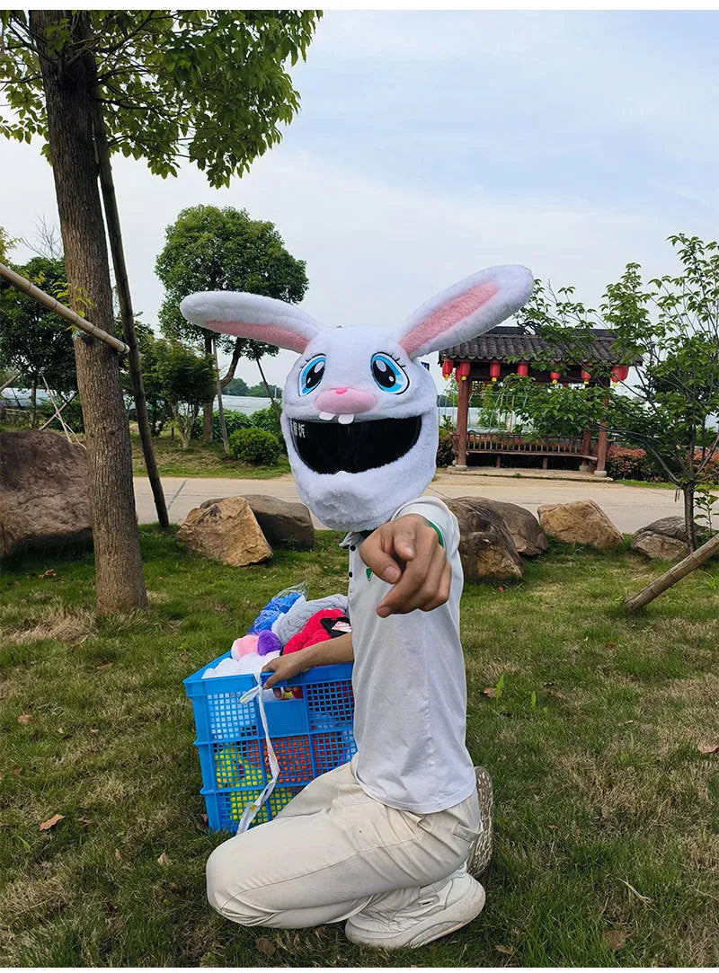 White plush rabbit head decorative cover for an electric motorcycle helmet.