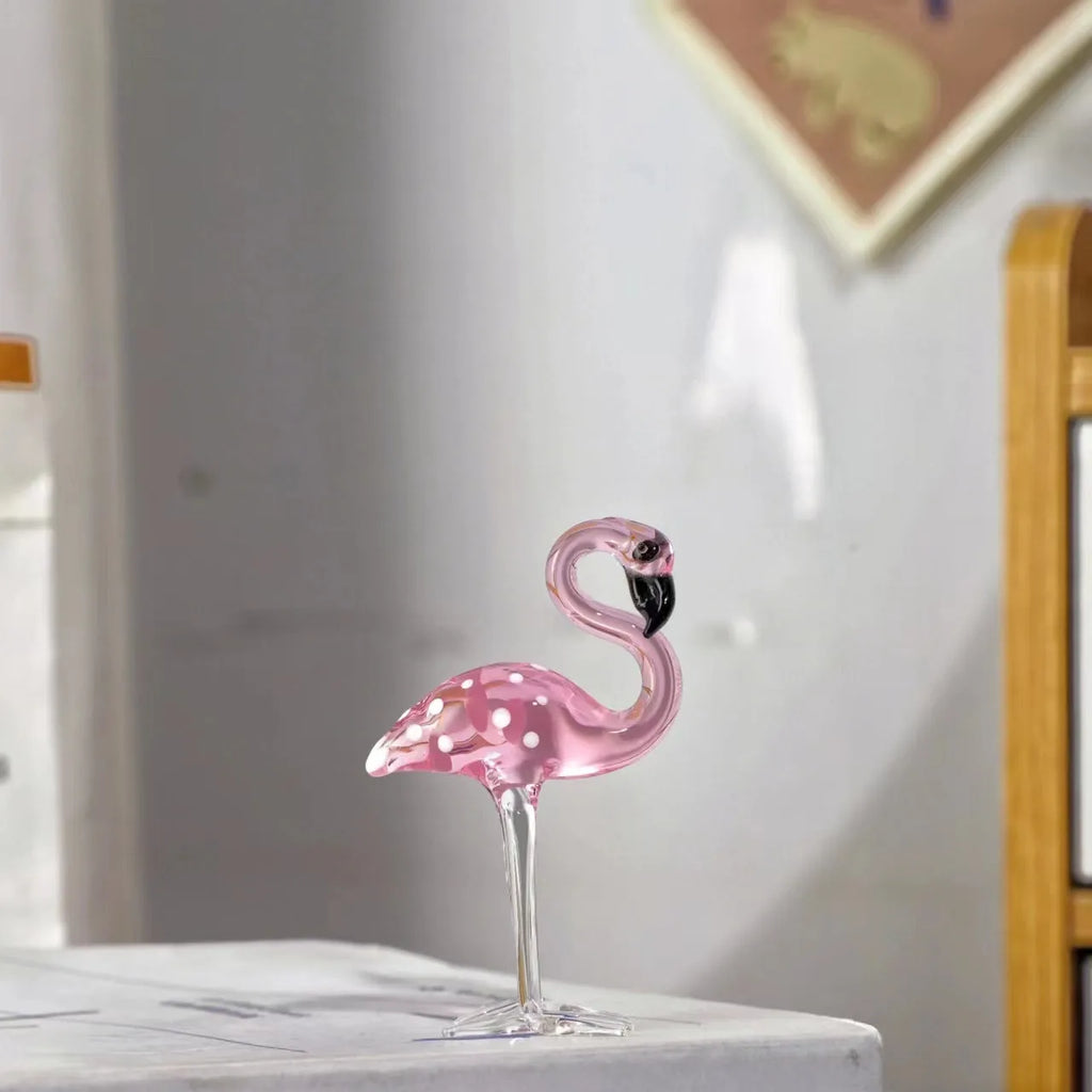 Pink flamingo crystal animal decoration on a tabletop in separate and juxtaposition styles.