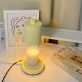 White European-style metal aromatherapy wax melt lamp with a dimmer switch on a table.