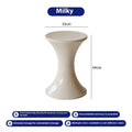 A plastic hourglass-style shoe changing stool in one of five available colours: black, green, red, white, or brown.